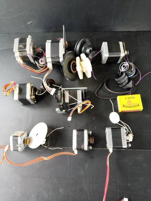 Stepper motors with some drive gears and belts joblot of 8 motors (used)