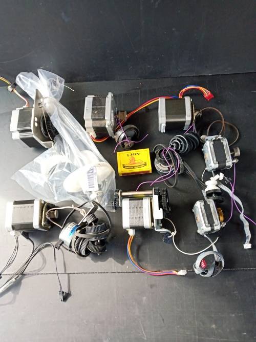 Stepper motors with some drive gears and belts, joblot 7 motors (used)