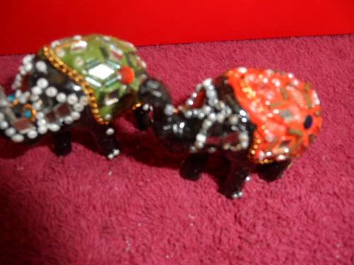 Small highly decorated elephants
