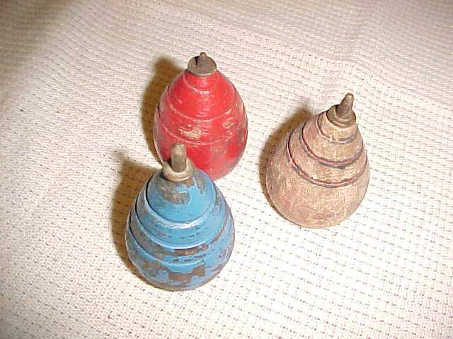 THREE VINTAGE WOODEN SPINNING TOPS