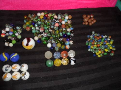 Huge Marble collection Ironies and glass and lion king small to large .  lovely collection