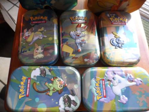 Beautiful pokemon tins look beautiful for cards 5 smaller and 2 larger all different