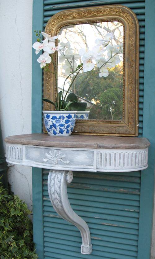 Beautiful pair of vintage wall mounted carved wooden table stands