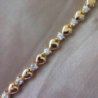 LOVELY!  TENNIS BRACELET WITH HEARTS & DIAMOND CZ  IN  18ct YELLOW GOLD PLATED over 925 SILVER.