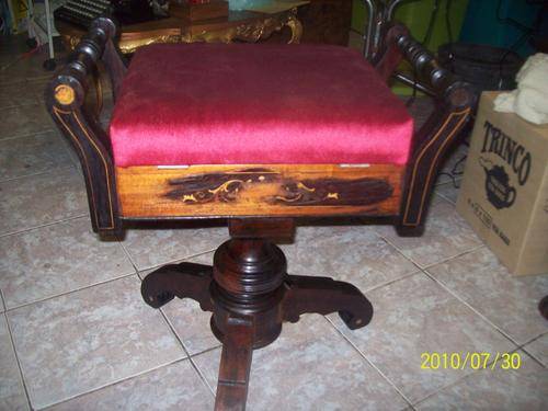 Piano stool, turn a round, look like stink wood.