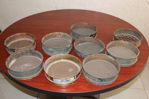 9 piece set of Copper and Brass Laboratory test sieves diameter 21cm height of stack 47cm