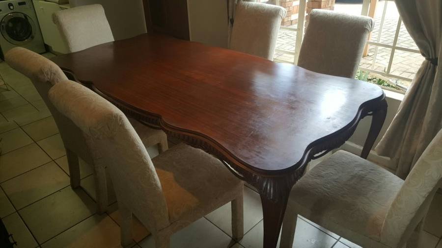 Beautiful Solid 8 Seater ornate Hand Carved Mahogany Dining Table with 6 Champagne Coricraft Chairs
