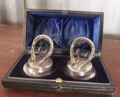 Boxed pair of hallmarked silver menu holders