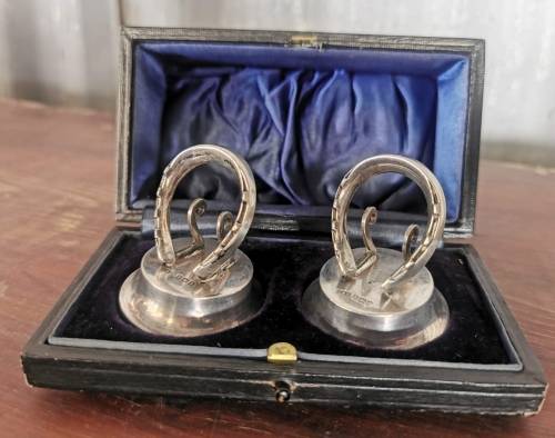 Boxed pair of hallmarked silver menu holders