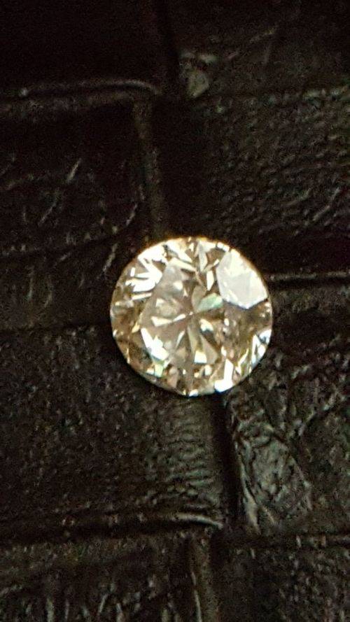 Cert 0.82Cts  Fancy Yellow VS2 Round Brilliant Natural Diamond