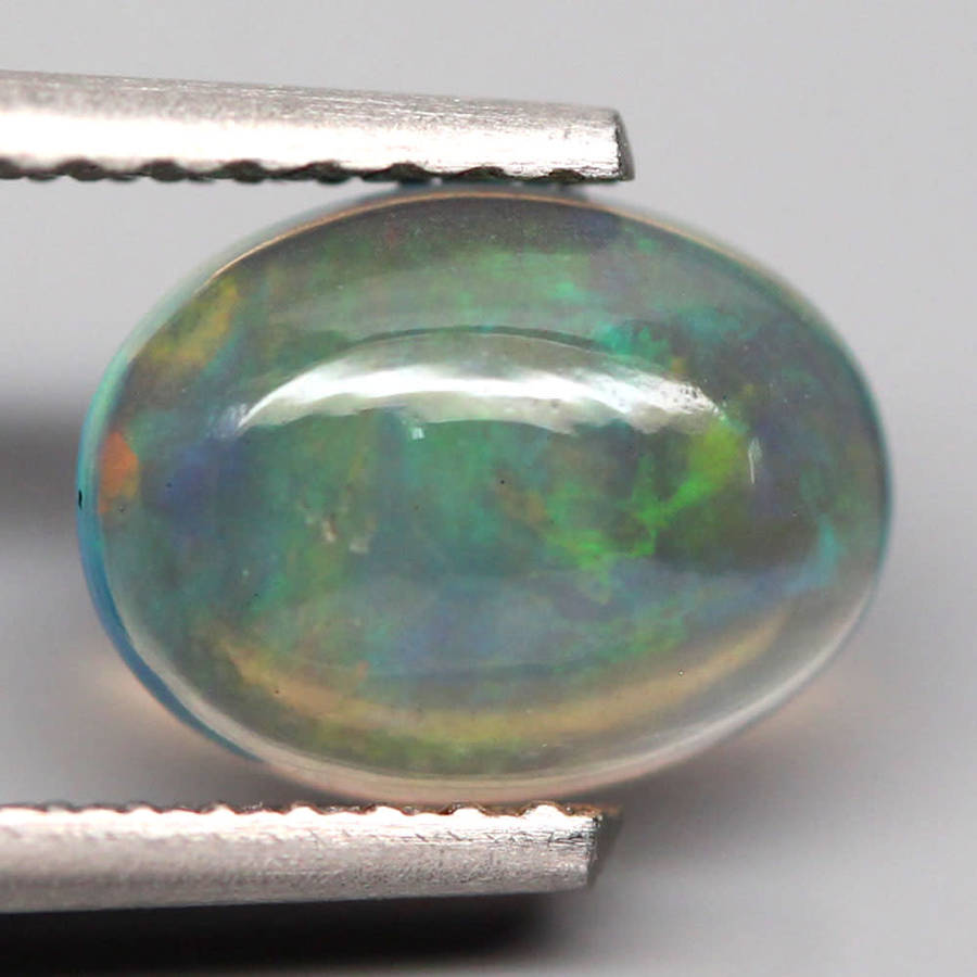 0.73Ct. Opal Oval Cabochon Multi Colours Glittering Rainbow 3D! Ethiopian Natural