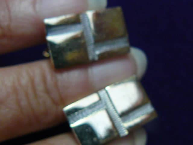Gold and silver toned cuff links