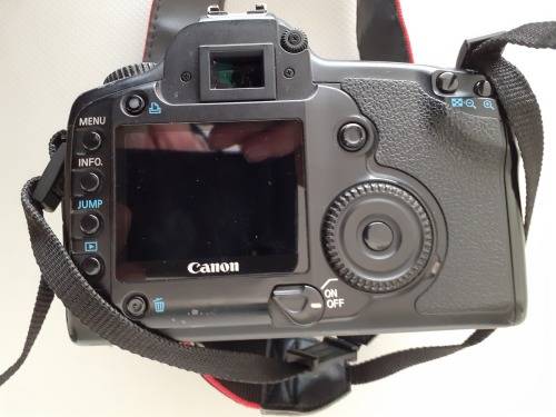 Used Canon 5D camera with Canon 50 mm f1.8 lens plus battery , charger and  plus Yongnuo speedlite a