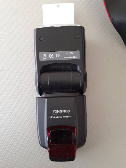 Used Canon 5D camera with Canon 50 mm f1.8 lens plus battery , charger and  plus Yongnuo speedlite a