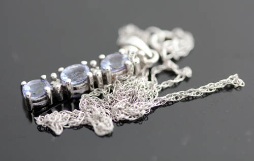 VINTAGE TANZANITE AND DIAMOND DELICATE PENDANT NECKLACE IN 10K WHITE GOLD. GEOMETRIC CUBE DESIGN.