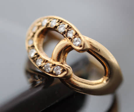 DAINTY VINTAGE 9CT YELLOW GOLD AND NATURAL DIAMOND HORSESHOE RING. 375. VERY SMALL SIZE