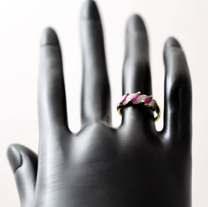 VINTAGE 9CT HALF ETERNITY YELLOW AND WHITE GOLD RUBY AND DIAMOND RING. 375