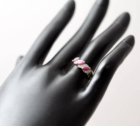 VINTAGE 9CT HALF ETERNITY YELLOW AND WHITE GOLD RUBY AND DIAMOND RING. 375