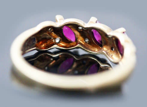 VINTAGE 9CT HALF ETERNITY YELLOW AND WHITE GOLD RUBY AND DIAMOND RING. 375