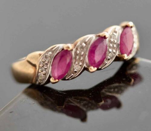 VINTAGE 9CT HALF ETERNITY YELLOW AND WHITE GOLD RUBY AND DIAMOND RING. 375
