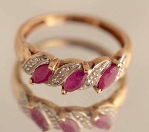 VINTAGE 9CT HALF ETERNITY YELLOW AND WHITE GOLD RUBY AND DIAMOND RING. 375
