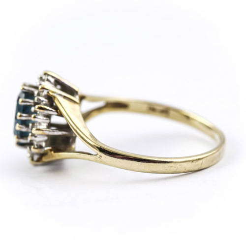 CLASSIC DESIGN  LONDON BLUE TOPAZ SOLITAIRE AND REAL DIAMOND FRAME 9CT YELLOW GOLD RING. 375.