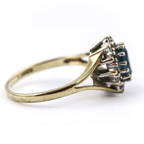 CLASSIC DESIGN  LONDON BLUE TOPAZ SOLITAIRE AND REAL DIAMOND FRAME 9CT YELLOW GOLD RING. 375.
