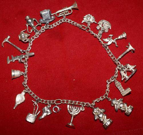 Vintage Silver Charms on silver chain - 19 diff charms, total weight 75gms