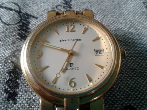 SOLID PIERRE CARDIN GENT'S WRIST WATCH. GOLD TONED WORKING CONDITION.