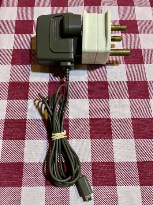 light blue Nintendo DS Lite with charger, stylus & case