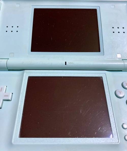 light blue Nintendo DS Lite with charger, stylus & case