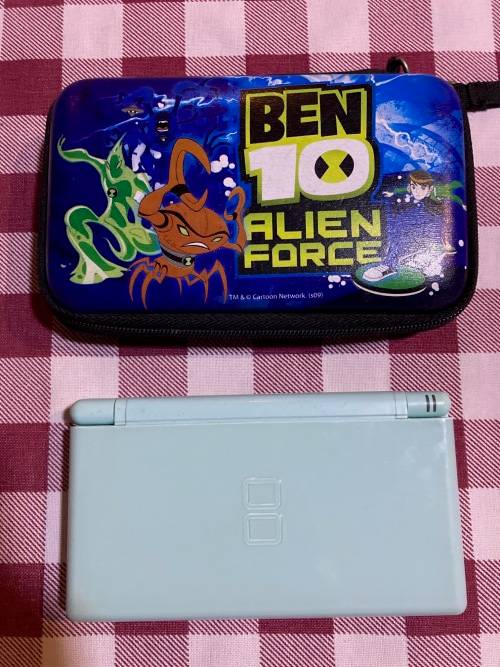 light blue Nintendo DS Lite with charger, stylus & case