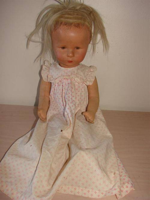 VINTAGE DOLL / WITH CELULLOID OR HARD PLASTIC HEAD AND MATERIAL BODY