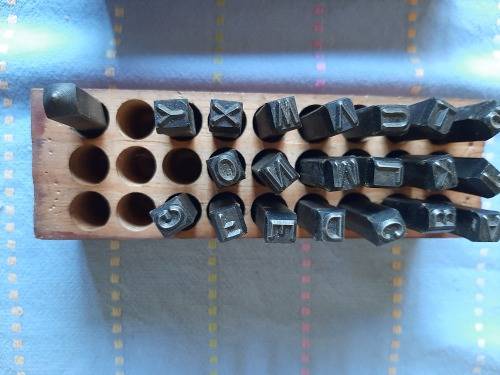 letter engraving set.  in wooden box (note 6 stamps missing)