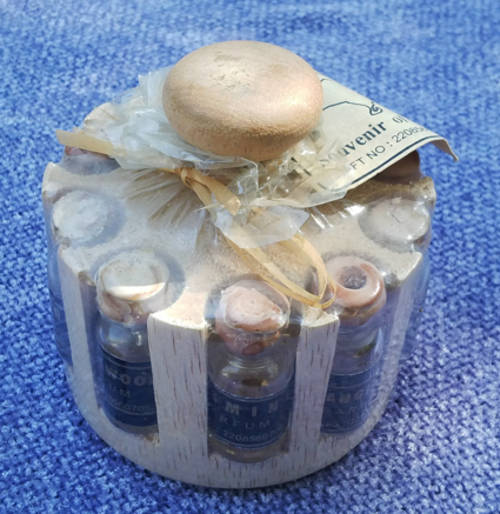 Souvenir from Bali (container full of perfume bottles) - 8x9cm