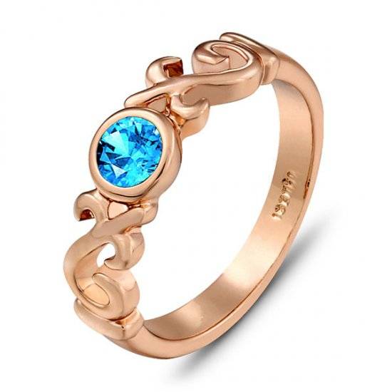 New 18K RGP stamped ladies crystal ring in rose gold with fine detail work and blue crystal