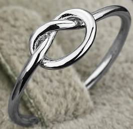 Genuine solid 925 sterling silver ring. Stamped 925. Infinity style, 1mm wide