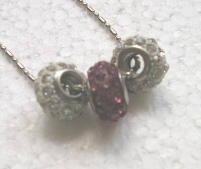 Trio of glitter balls on silver chain