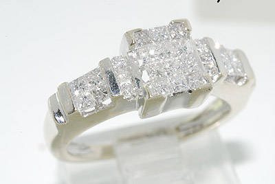 R50000 - DAZZLING 1.00CT INVISIBLE SET PRINCESS CUT DIAMOND RING