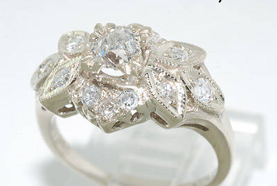 R50000 - OUTSTANDING .68CT FLOWER DESIGN ANTIQUE STYLE DIAMOND RING