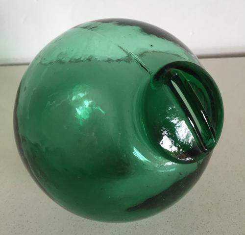 Unusual glass ball with slot