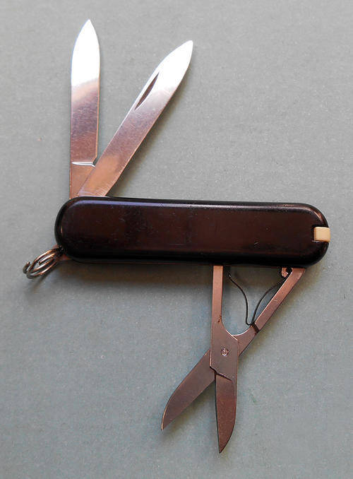 A small Victorinox Pocket knife, Black with SAA Logo.
