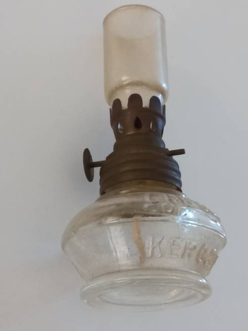 small antique kerosene lamp and glass holder