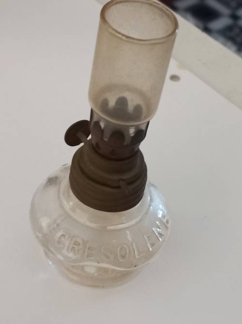 small antique kerosene lamp and glass holder