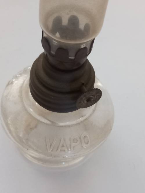 small antique kerosene lamp and glass holder