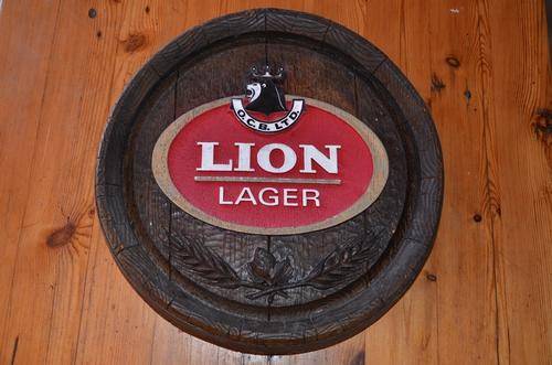 Large "barrel end" Lion Lager bar sign