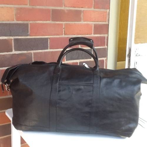 A Beautiful Black Leather Holdall.