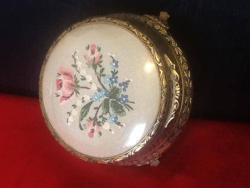 A Vintage Powder Holder with Embroidered Flowers.