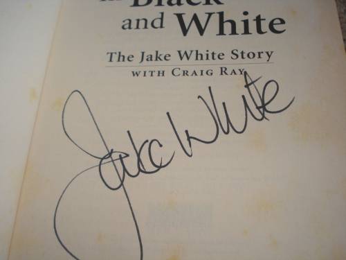 TWO SPORTS MEMORABILIA BOOKS SIGNED BY JAKE WHITE AND MICHAEL MARNEWICK