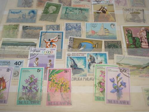 WORLD COLLECTION IN TWO STOCK BOOKS-ANYTHING COULD BE IN THESE !! READ BELOW